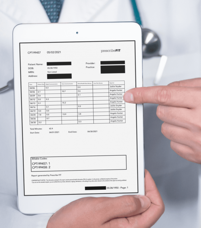 A doctor holds a tablet with Reimbursement for Remote Patient Monitoring codes