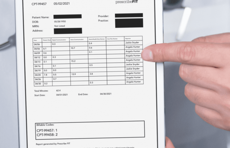 A doctor holds a tablet with Reimbursement for Remote Patient Monitoring codes